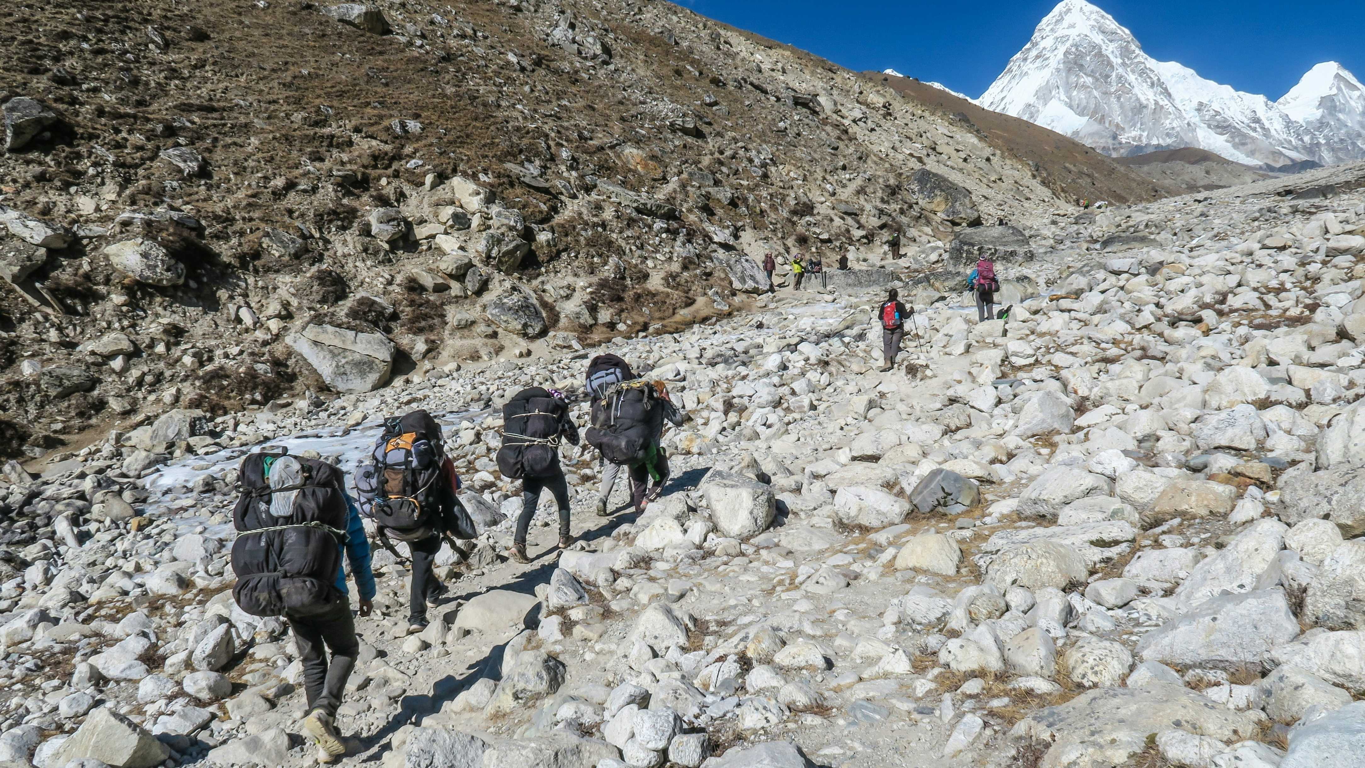 Person organizing video clips on a laptop screen